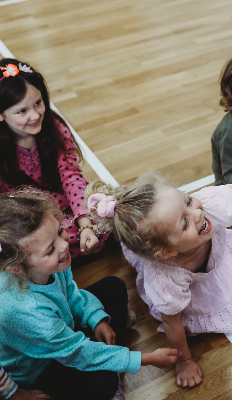kids on the floor playing a game<br />
