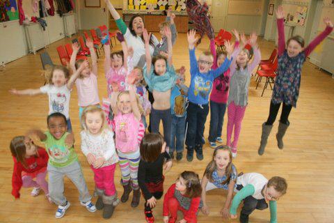 All of the Glasshouse Mini Kids shouting at the camera.